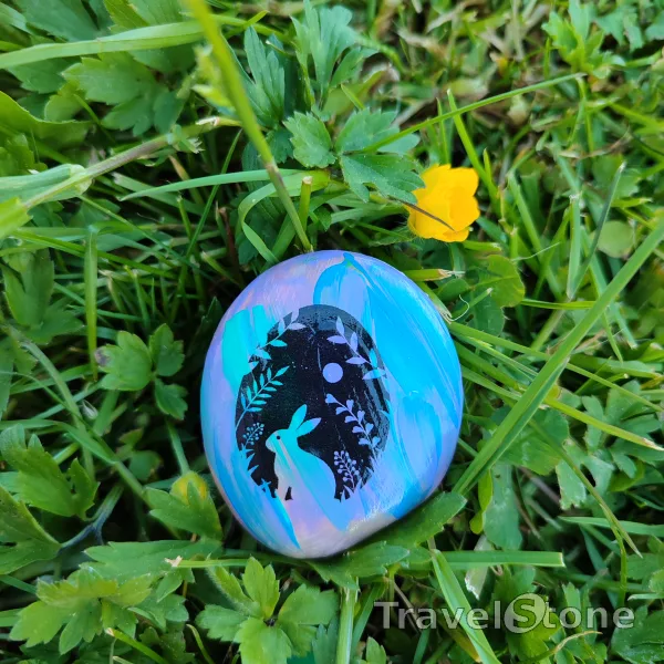 Painted painting stone by artist LaLiLu showing special occasion. Easter TravelStone