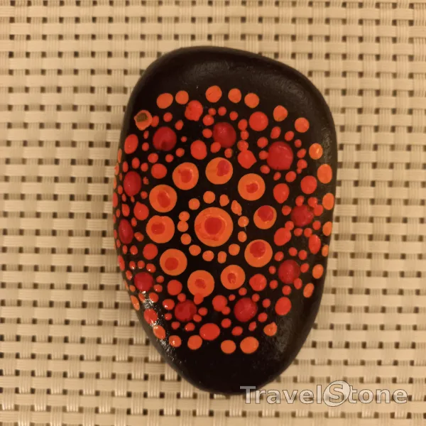 Painted dotting stone by artist Yumi showing pattern. Mandalastein