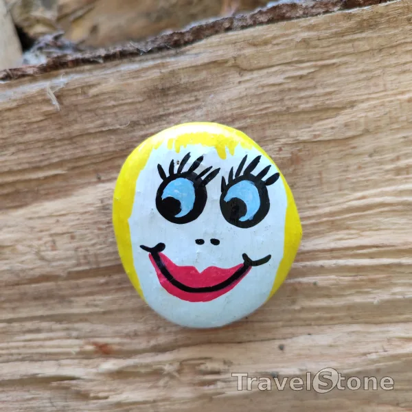 Painted painting stone by artist CJ showing comic. My daughter has painted this TravelStone :-)