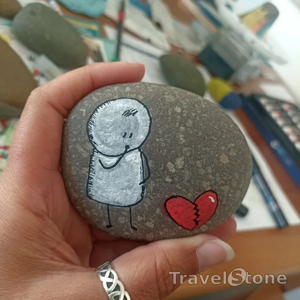 Painted painting stone by artist comfortinstones showing comic. Heartbreak