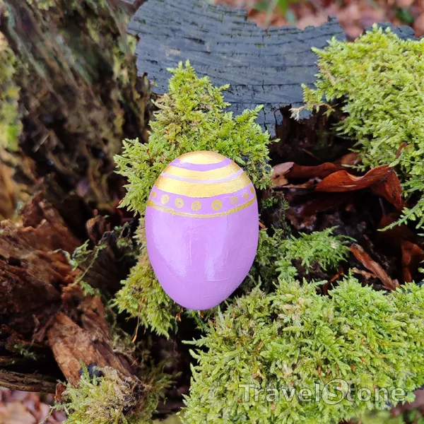 Painted painting stone by artist CJ showing pattern. Painted stone with gold pattern.