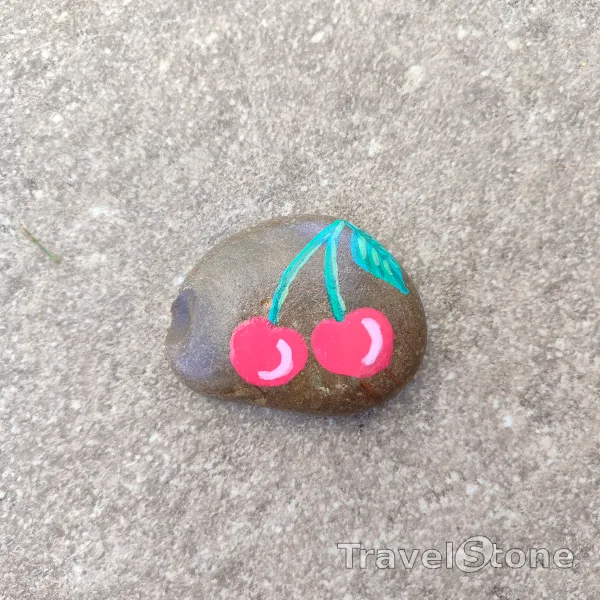 Painted painting stone by artist CJ showing food. Cherry TravelStone