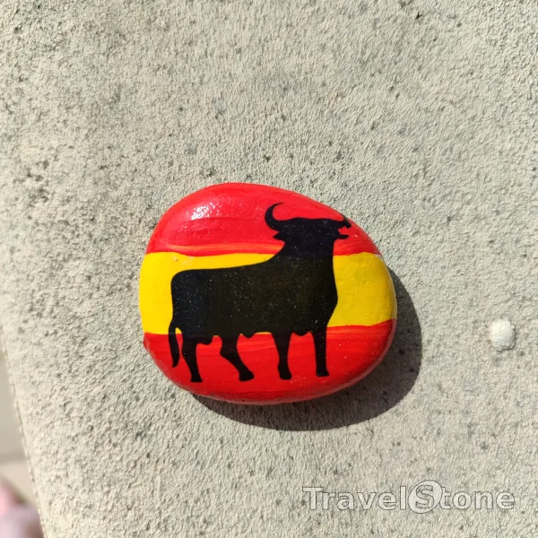 Painted painting stone by artist CJ showing animals. Spanish Bull TravelStone