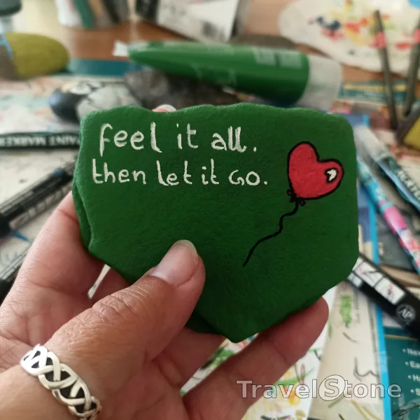 Painted painting stone by artist comfortinstones showing sayings. Feel it all. Then let it go.