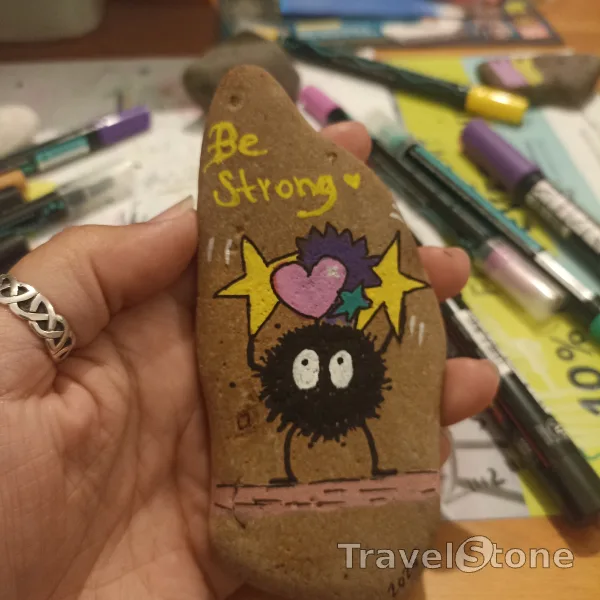 Painted painting stone by artist comfortinstones showing comic. Be strong. Susuwatari by Studio Ghibli