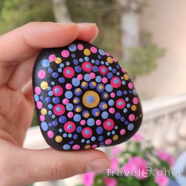Painted dotting stone by artist CJ showing pattern. Mandala