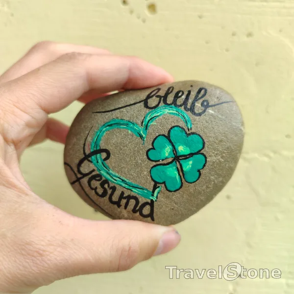 Painted painting stone by artist 007 showing sayings. Viel Glück auf Deiner Reise TravelStone