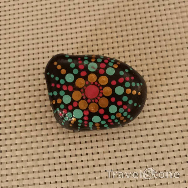 Painted dotting stone by artist Yumi showing pattern. Mandalastein