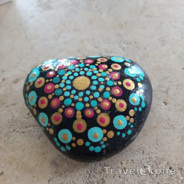 Painted dotting stone by artist Yumi showing pattern. Mandala