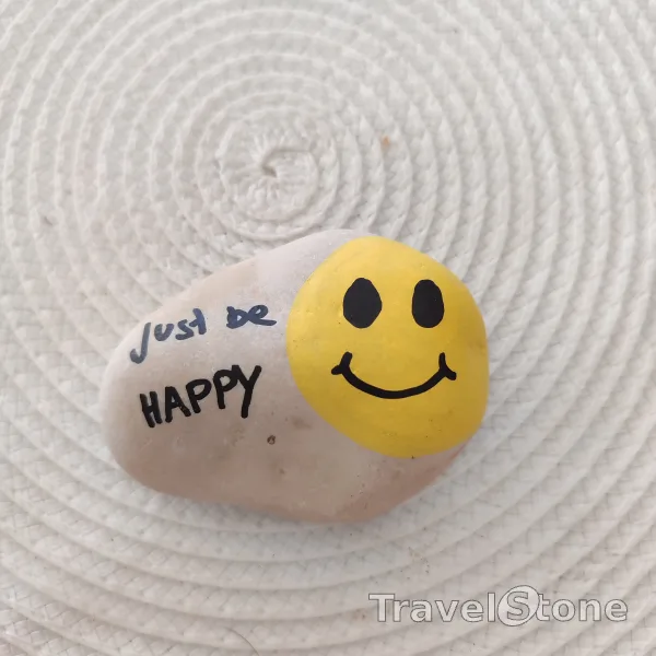 Painted painting stone by artist CJ showing fantasy. Smiley TravelStone
