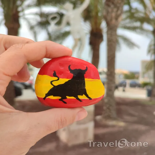 Painted painting stone by artist CJ showing animals. Spanish Bull