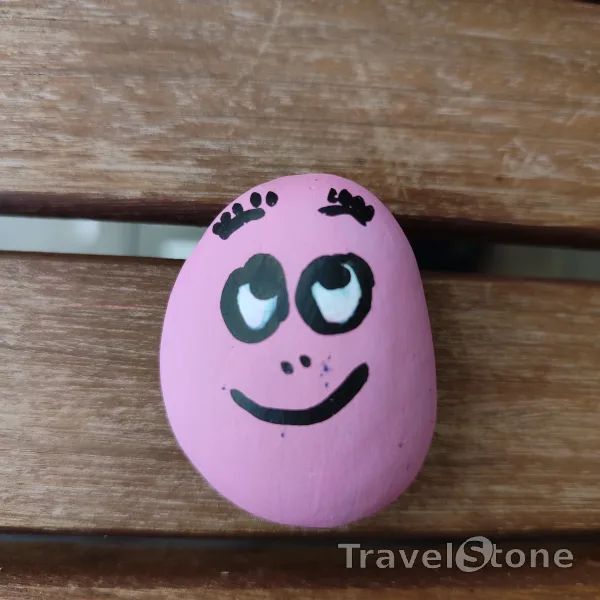 Painted painting stone by artist CJ showing comic. Funny face TravelStone