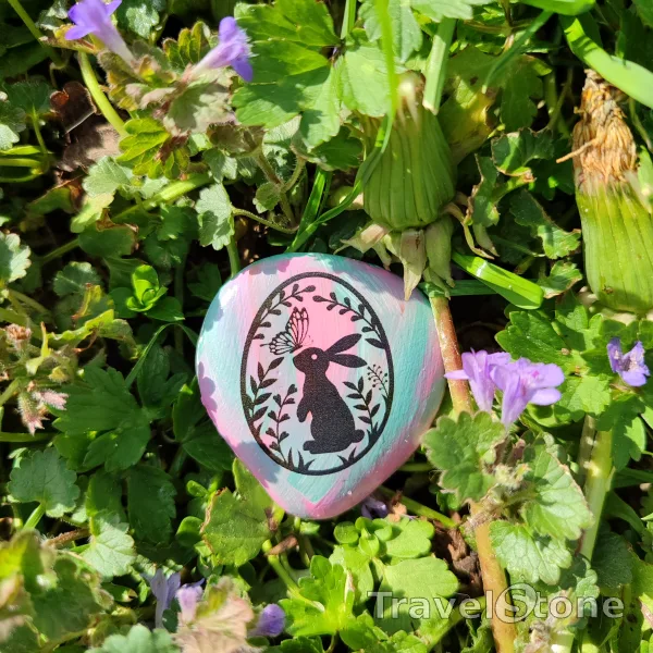 Painted painting stone by artist LaLiLu showing special occasion. Easter TravelStone
