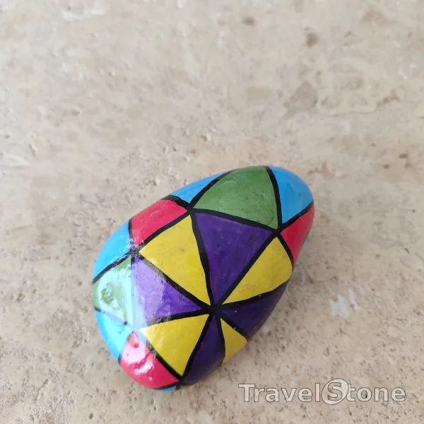 Painted painting stone by artist CJ showing pattern. Colourful TravelStone