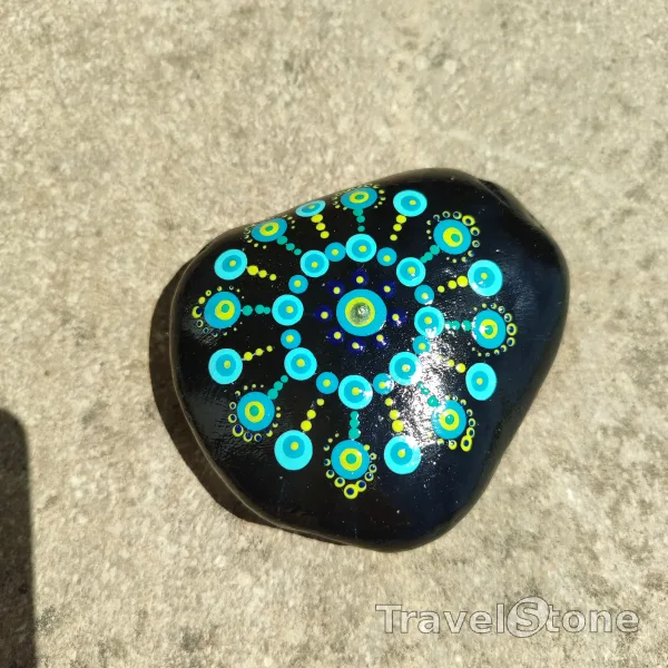 Painted dotting stone by artist CJ showing pattern. Mandala