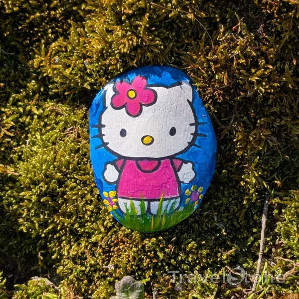 Painted painting stone by artist Ella showing comic. Rock painted -cute Hello Kitty