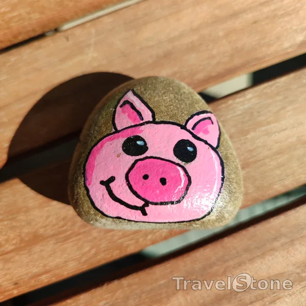 Painted painting stone by artist 007 showing animals. Pig travelstone. Acrylic painted stone