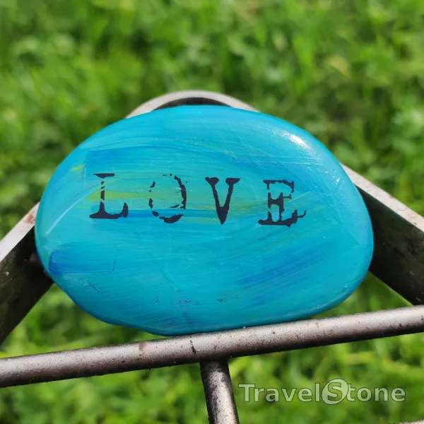 Painted painting stone by artist LaLiLu showing sayings. Love is in the Air!