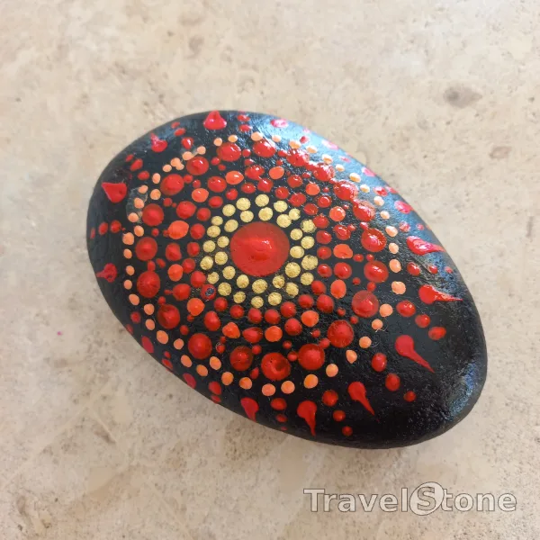 Painted dotting stone by artist Yumi showing pattern. Mandalastein