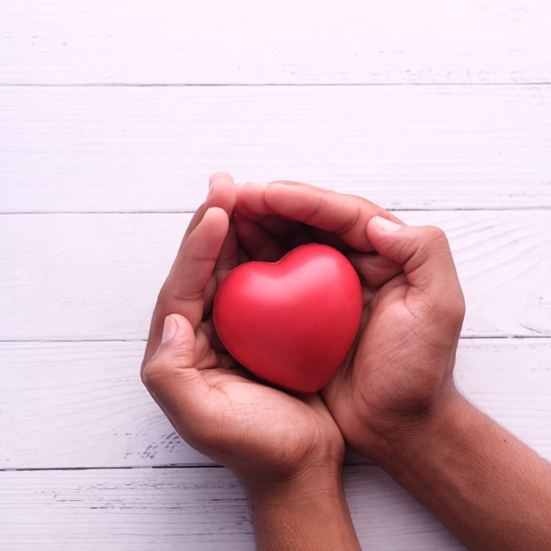 Someone holding a plastic heart — Myers Boost IV therapy