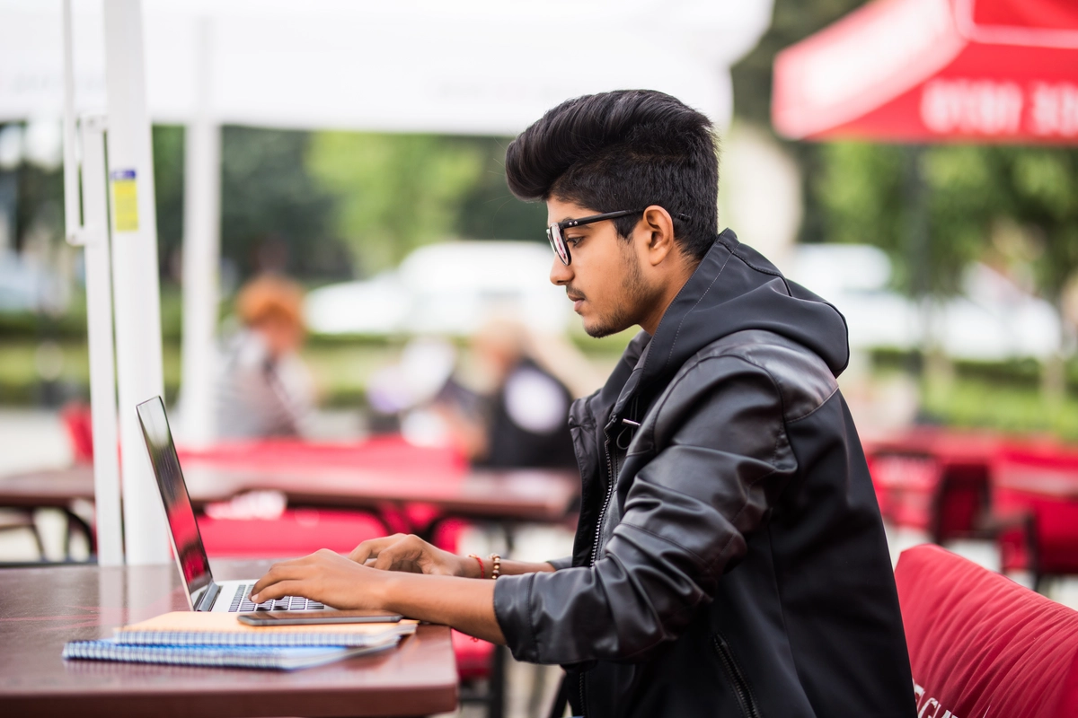 Student working on a laptop — building skills before a degree