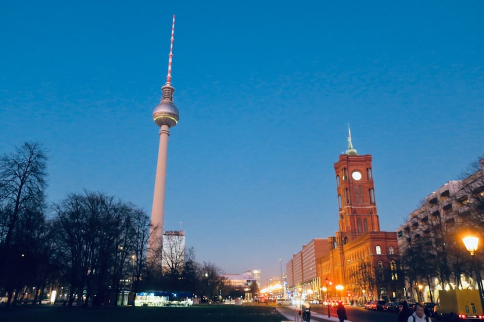 a tall clock tower towering over a city at night