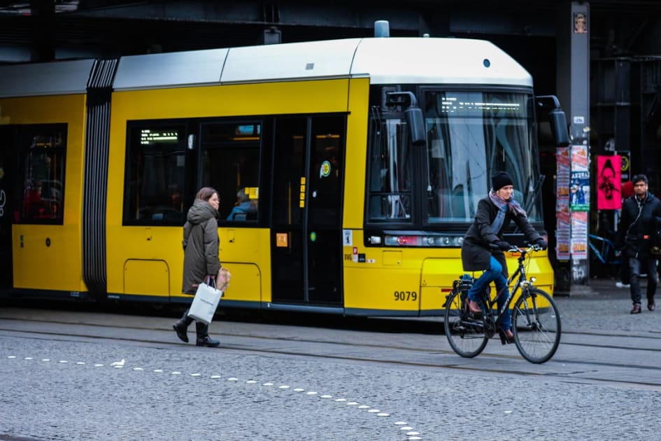 a person riding a bicycle next to a person on a bicycle