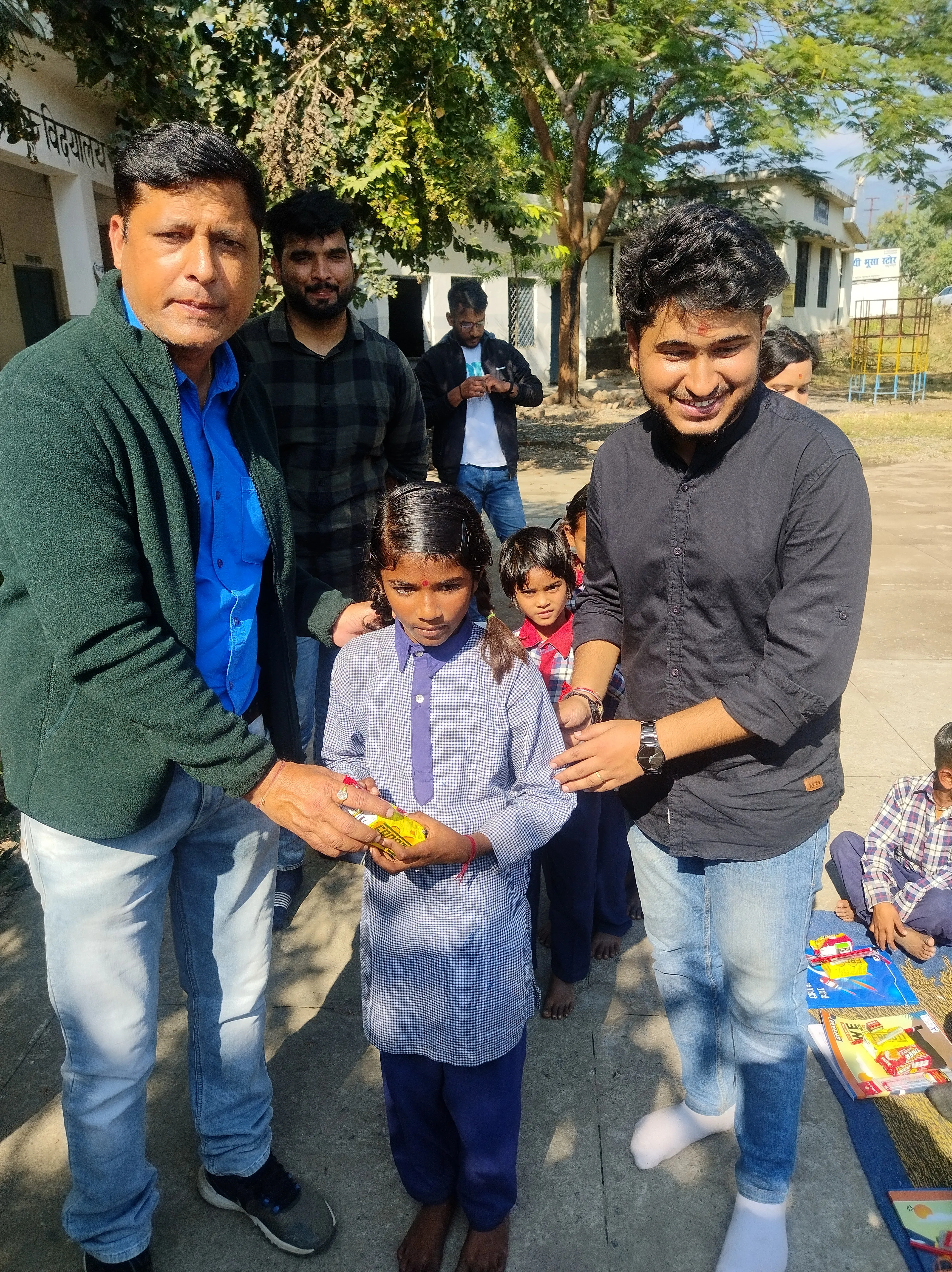 Smiling student receiving items