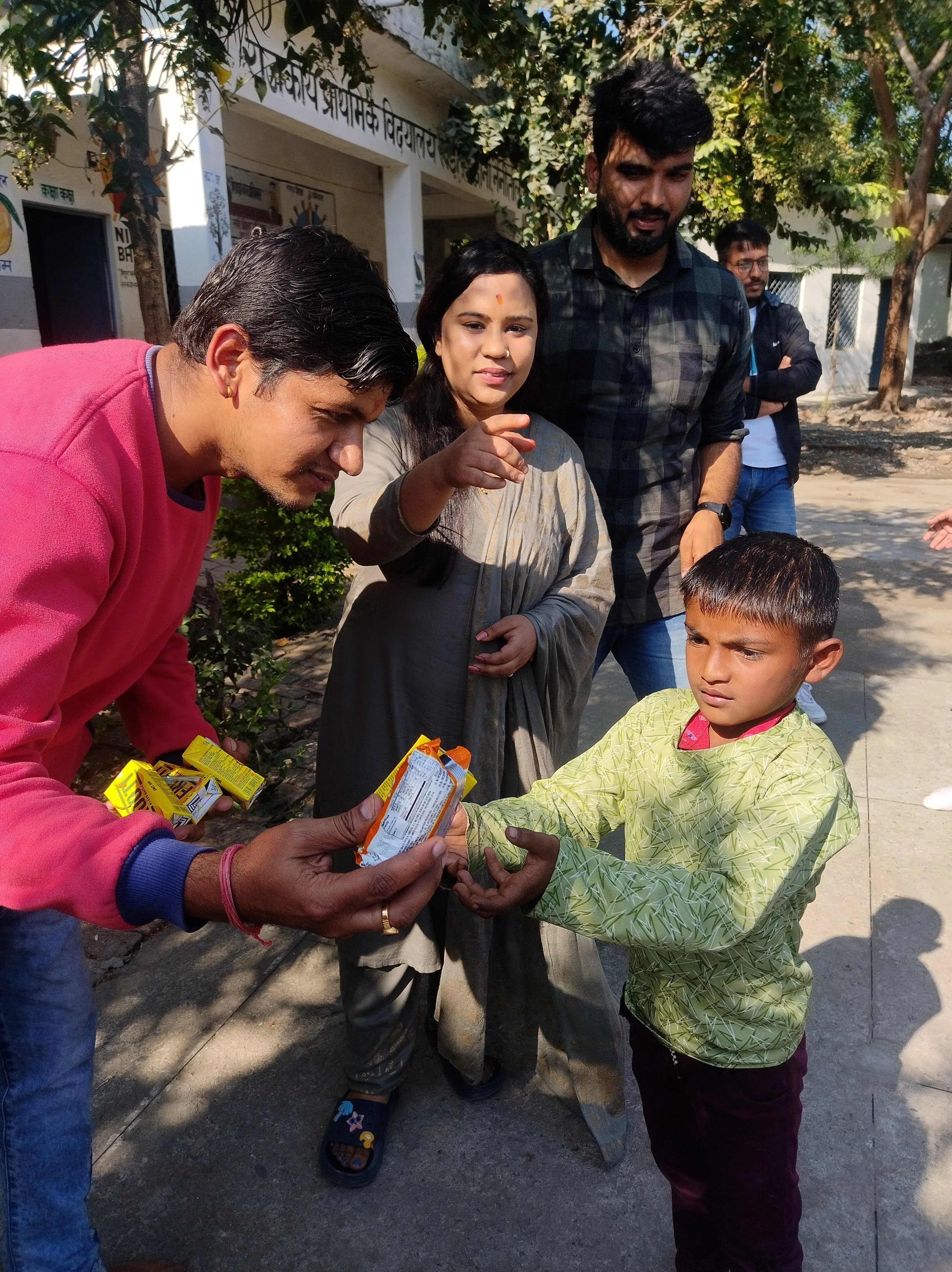 Smiling student receiving items