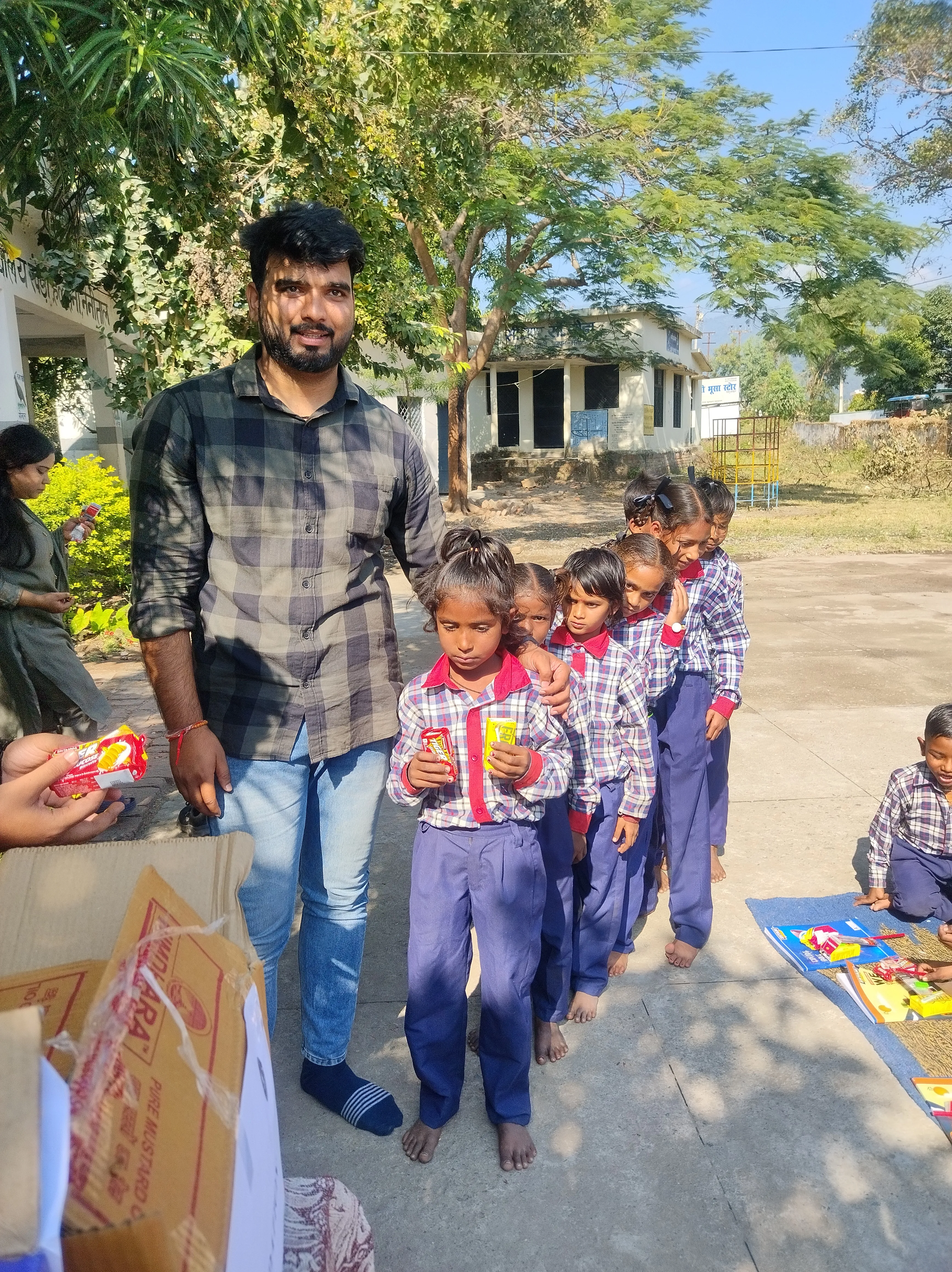 Smiling student receiving items
