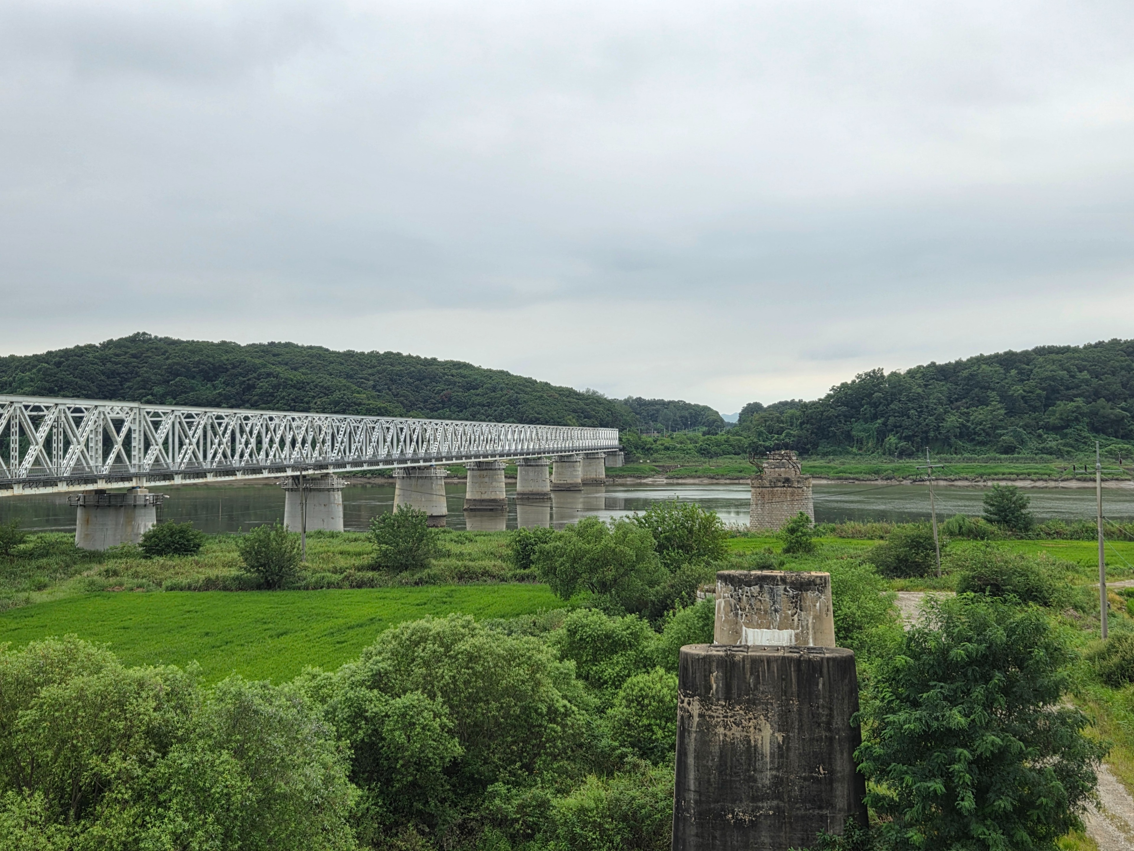 The railway bridge over the Imjin River and the remains of the previous interrupted structure.