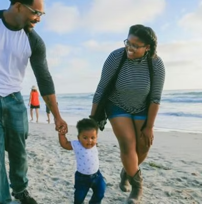 Family walking on the beach