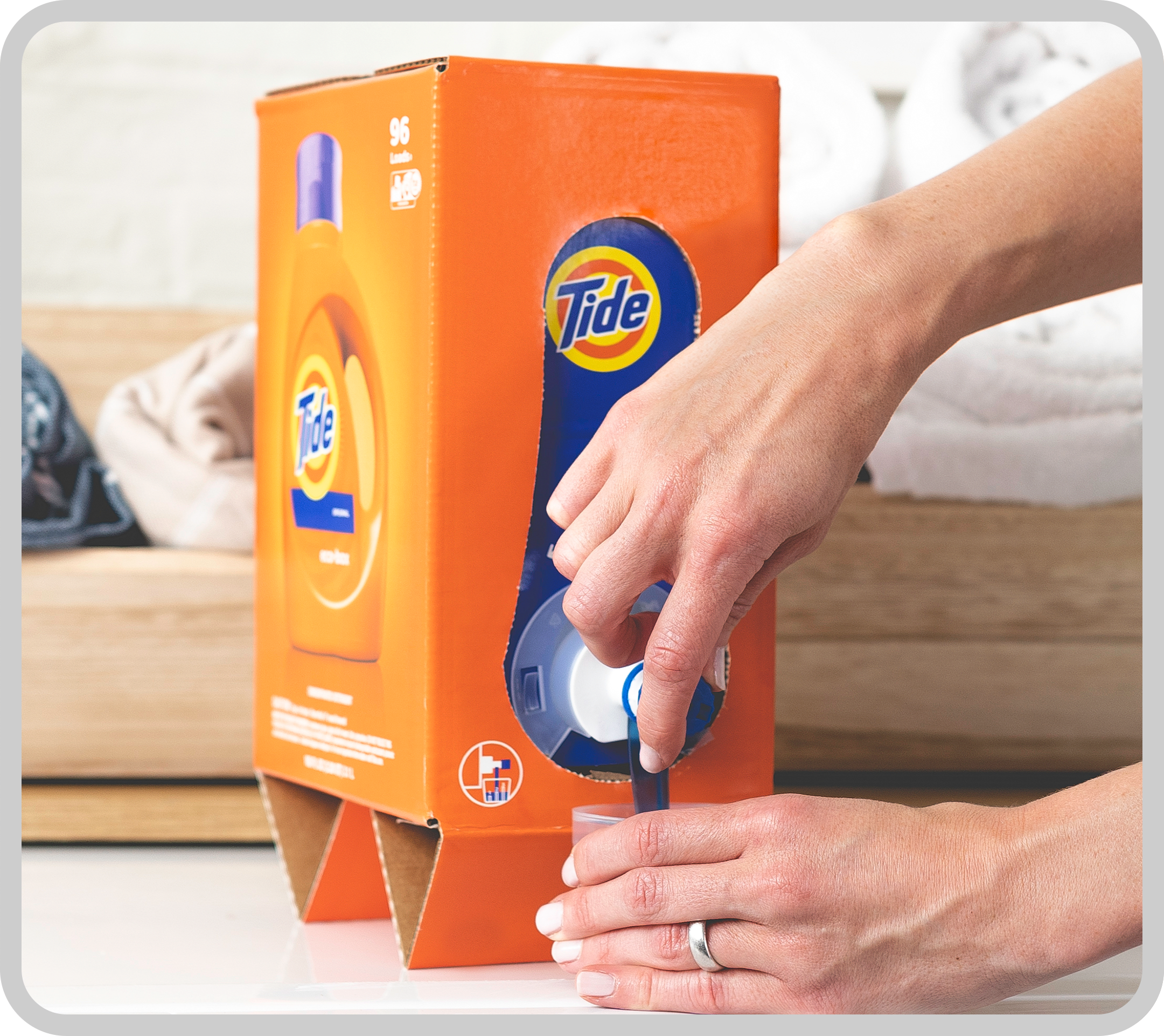 The Tide Eco-Box with detergent pouring out