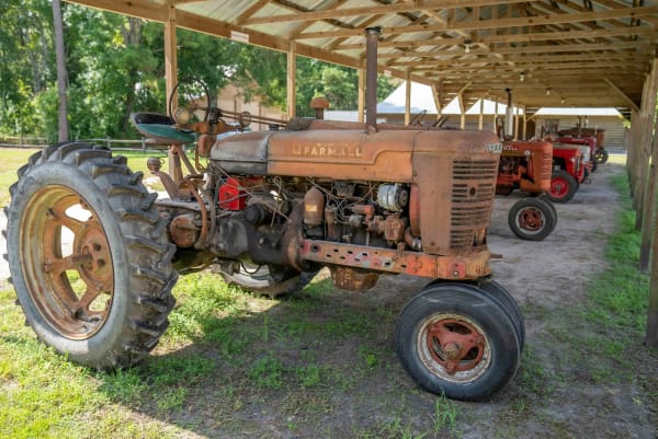 Different types of tractors ready for scrap collection