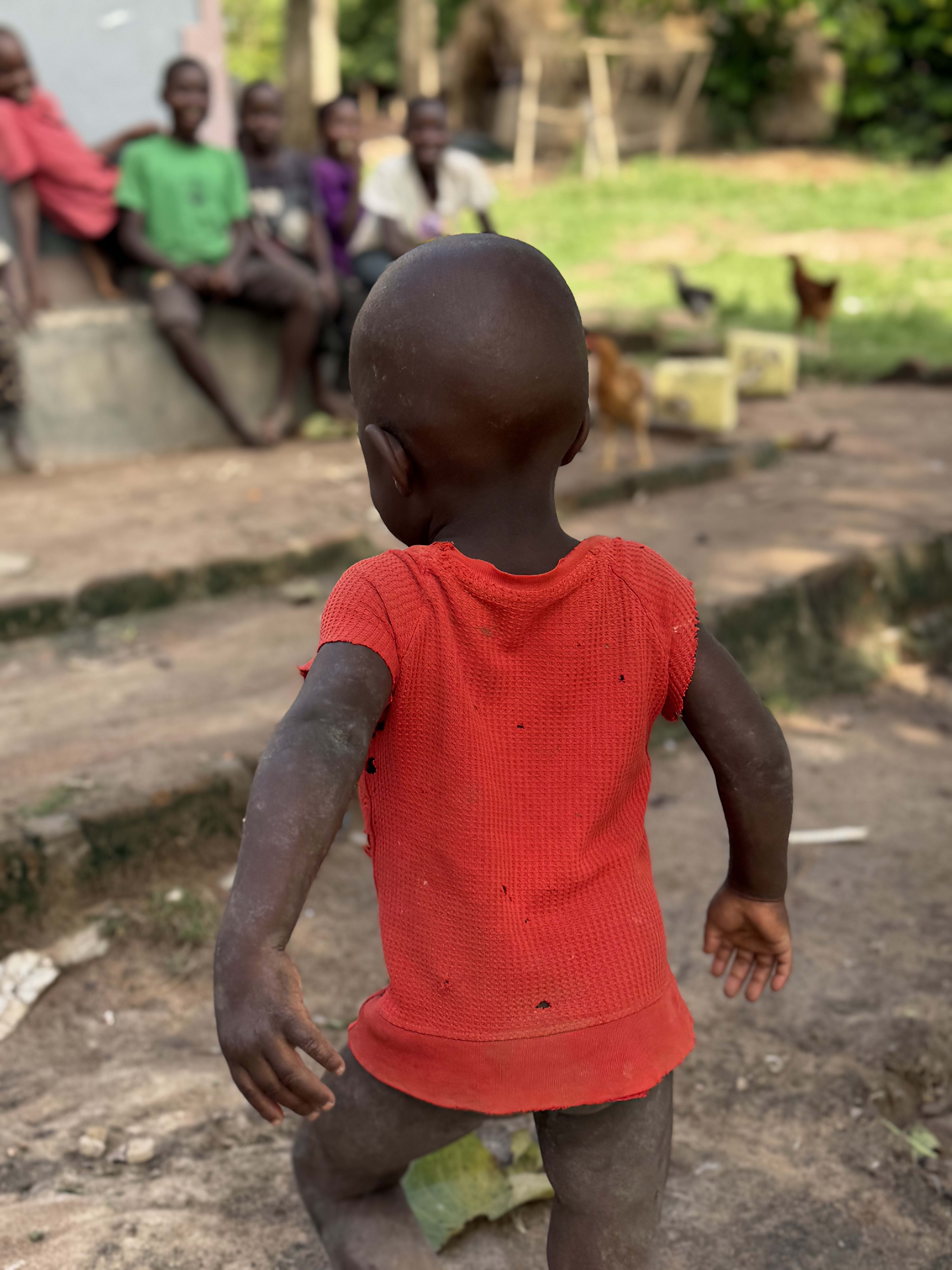 Children and families gathered in a rural community