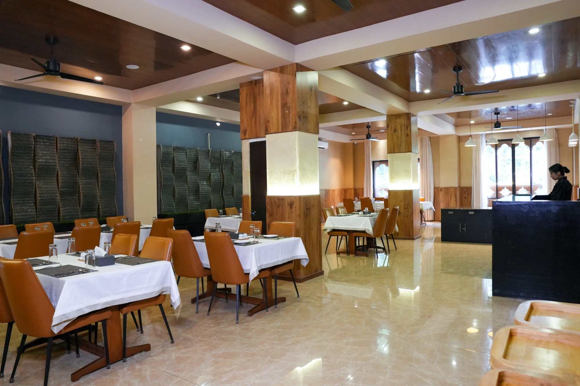 The restaurant — tables set, evening light