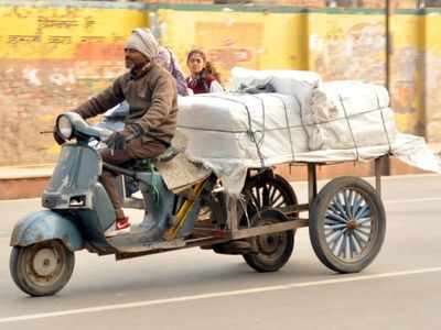 An old scooter modified to carry a cart