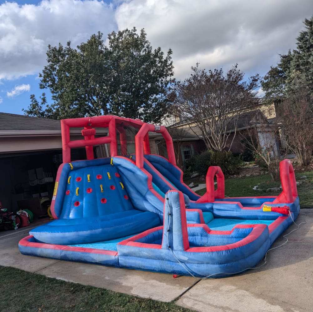 Inflatable bouncer set up on green grass for an Easter bounce house rental San Antonio egg hunt