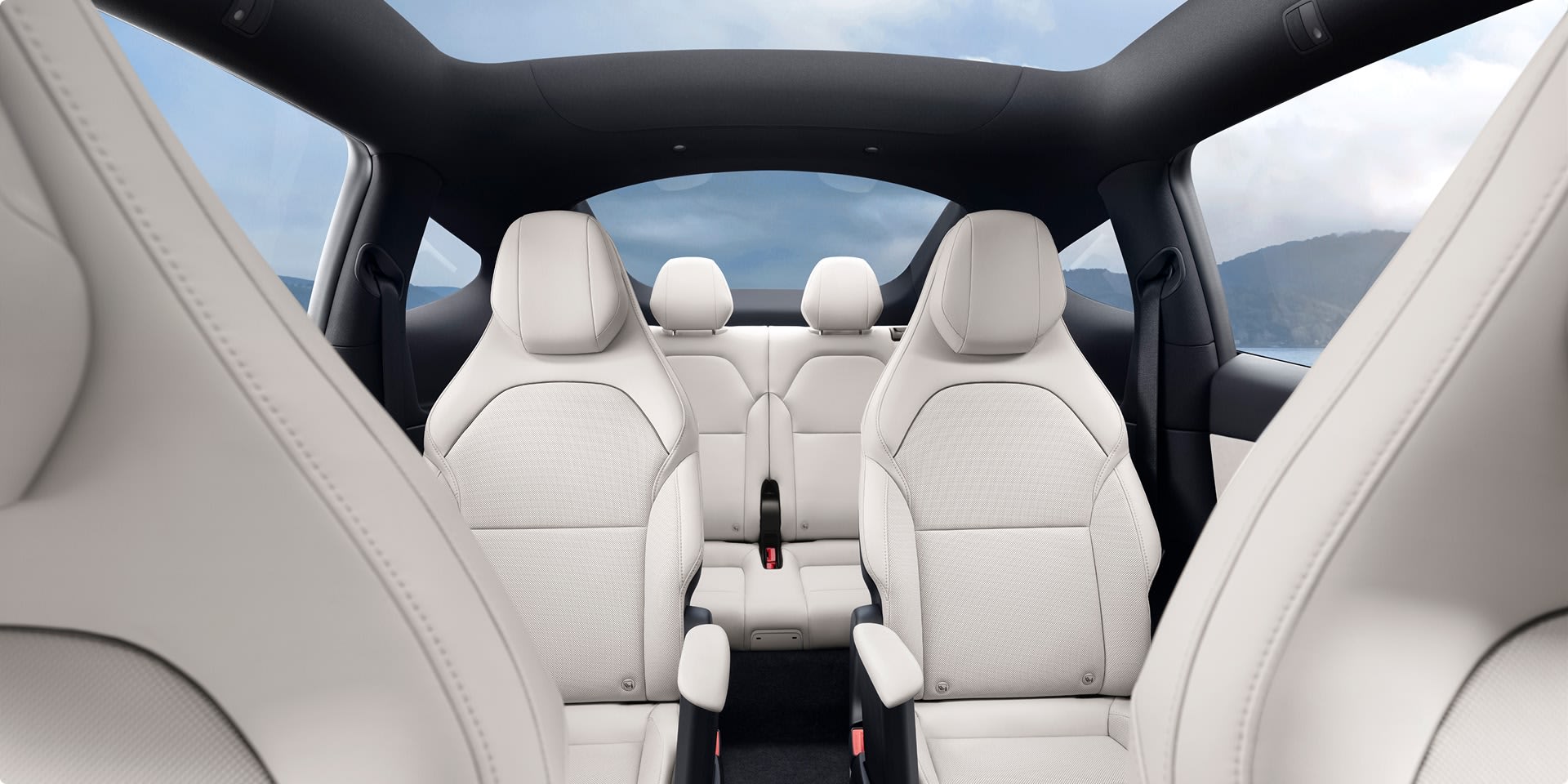An interior shot of Model Y L with three rows of white seats.