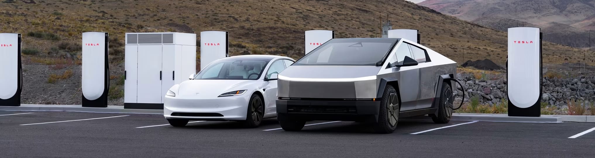 Model 3 and Cybertruck parked at a Supercharging station
