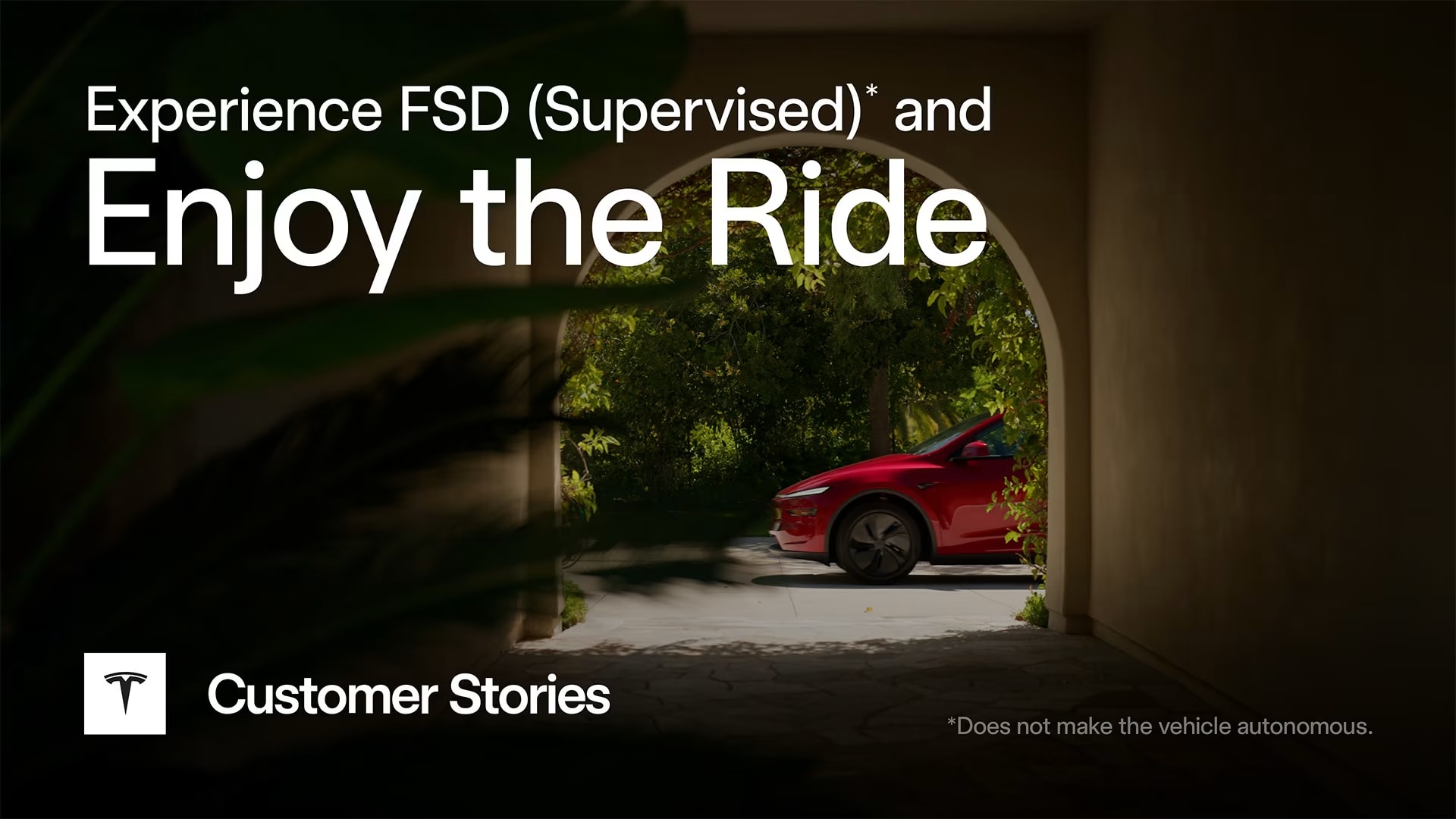 Vehicle driving through an archway surrounded by greenery
