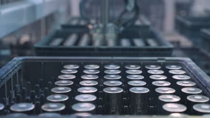 Rows of batteries on an assembly line conveyor