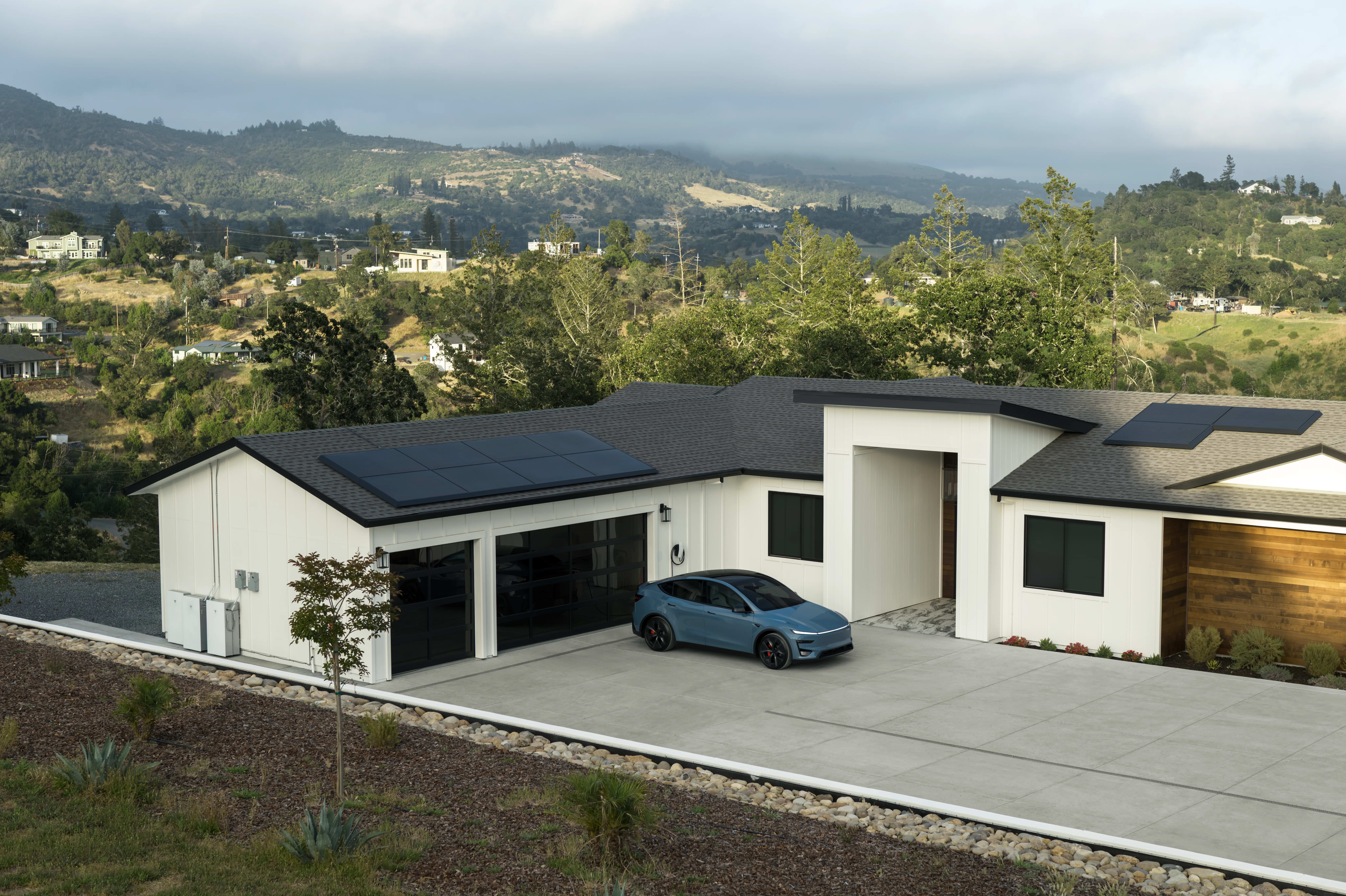 Home with solar panels and vehicle