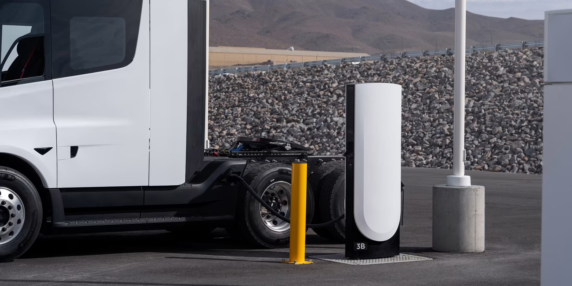 Electric Semi truck charging at a stop by the highway