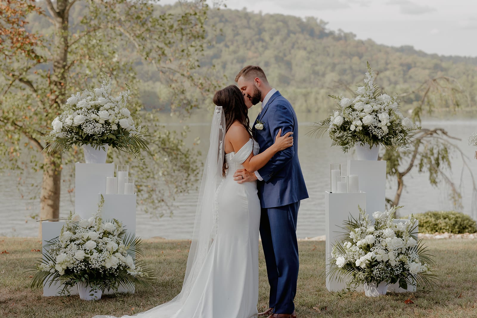Waterfront Wedding Ceremony Couple Kiss