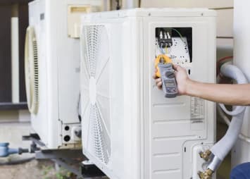 A Technician Tuning An AC