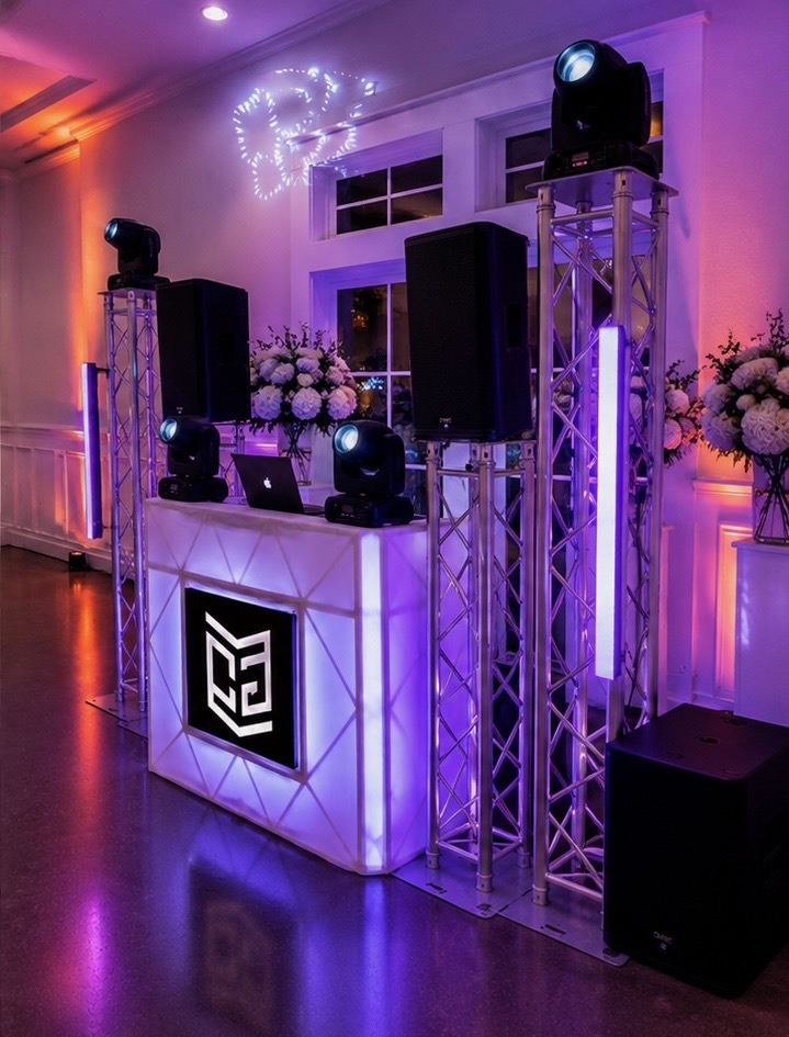 Wedding reception DJ booth with lighting towers