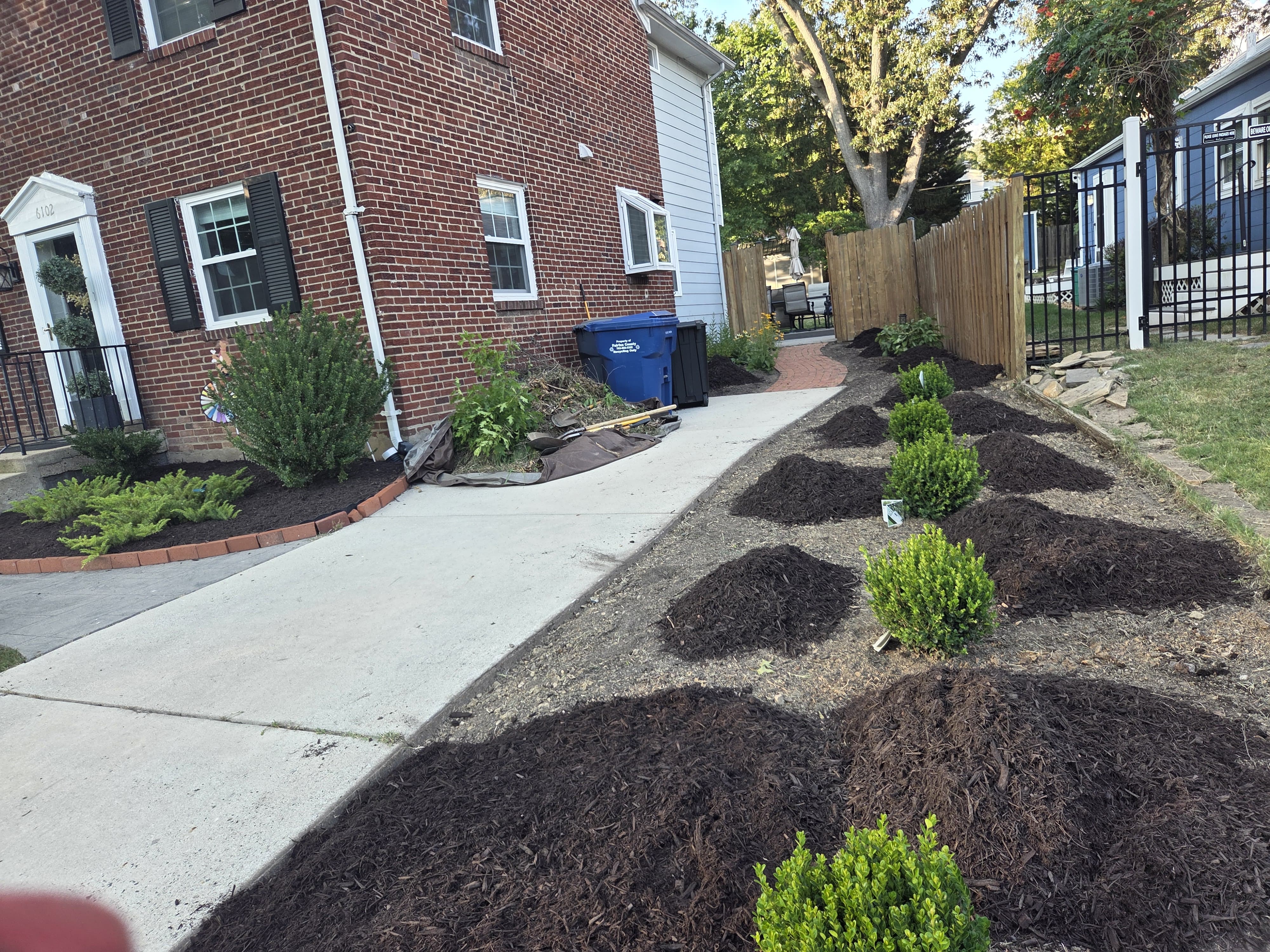 Maintained lawn and garden beds on a property in the Northern Virginia & Potomac, MD area