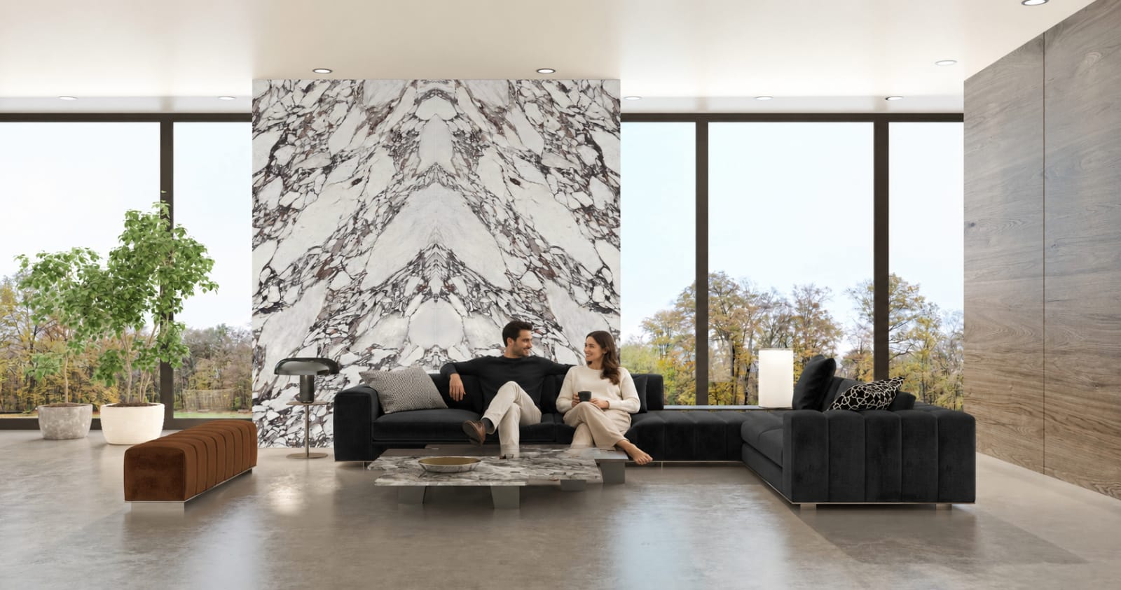 A grand open-plan living room with a large book-matched Calacatta Viola marble-look mega-slab feature wall, the veining mirrored floor to ceiling.