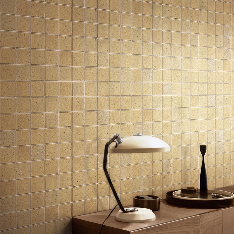 Kazoku Hatsu Square hand-glazed Japanese mosaic tile on a feature wall, showing glossy colour variation.
